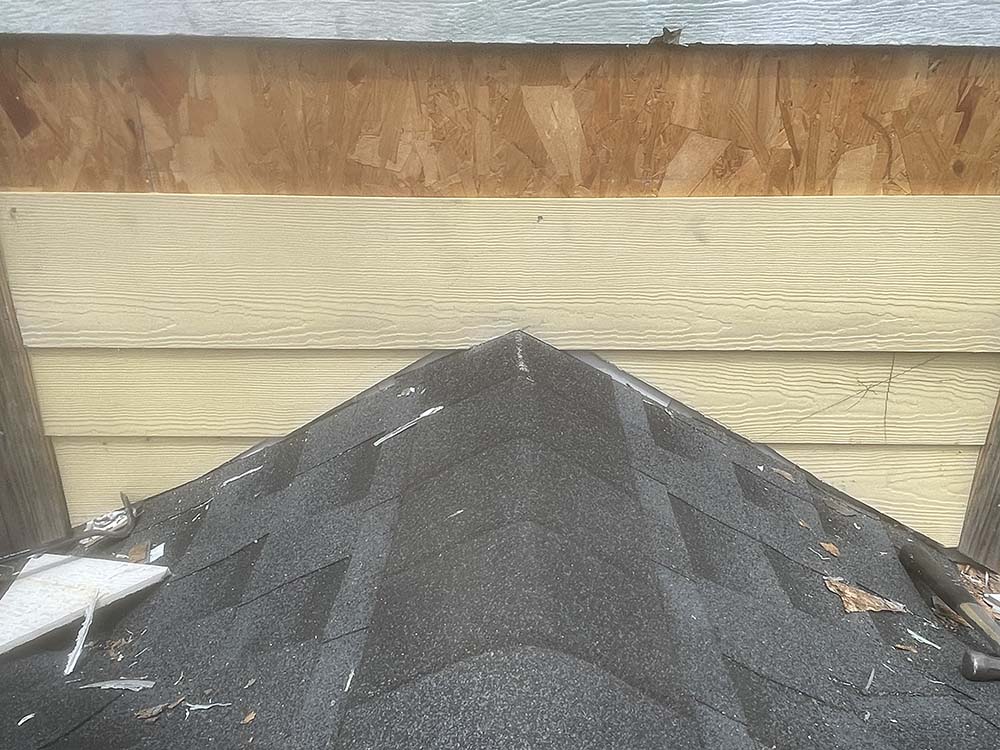 Chimney roof junction siding repair and flashing integration in Fayetteville NC